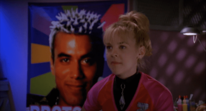 Zenon in front of a Poster of Proto Zoa